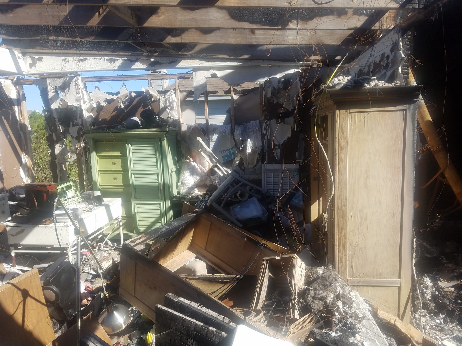Fire-damaged room before rehab at Benthos Dr