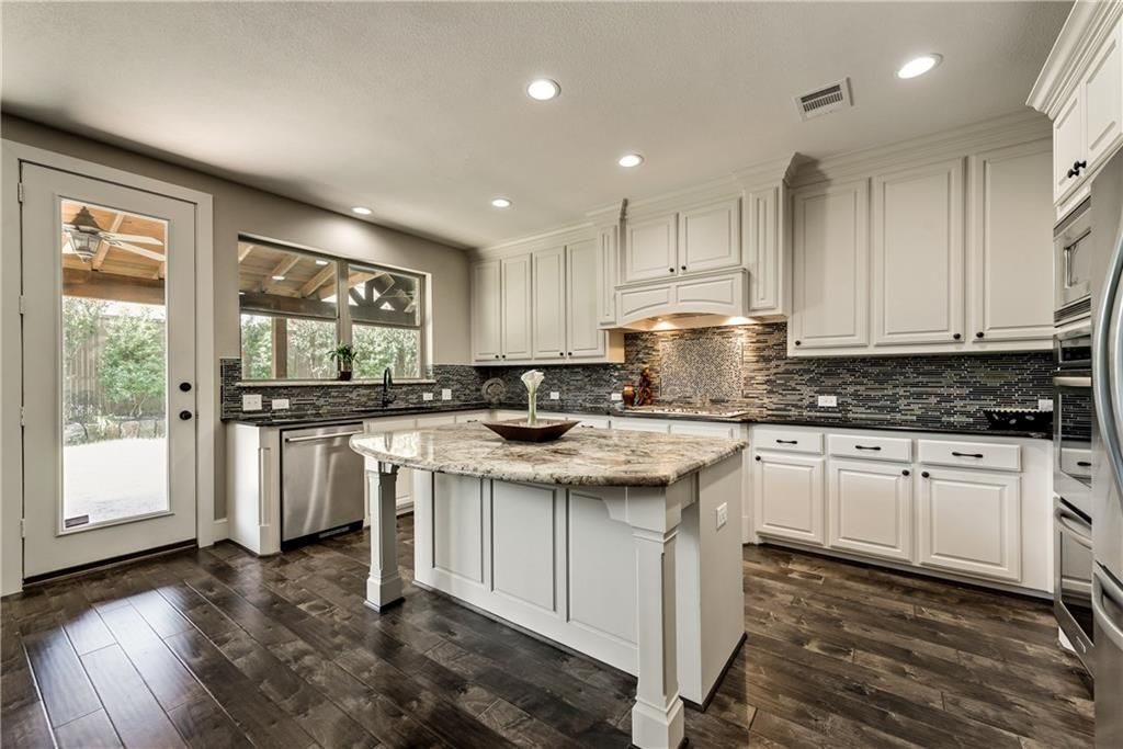 White cabinetry and a center island